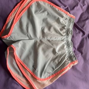 Nike brand running shorts: gray with coral trim